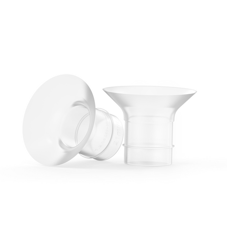 Two transparent Ameda breast pump flanges with a wide, cone-shaped design are shown; one is standing upright and the other is lying on its side, revealing a blue dot on the side.