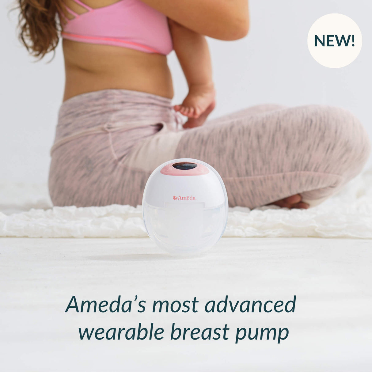 Ameda's most advanced wearable breast pump on a white background with a person sitting in the background.