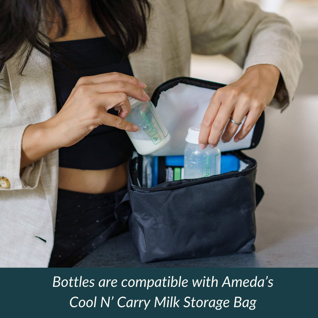 Woman placing filled Ameda bottles into a black insulated cooler bag with text about compatibility with Ameda’s storage bag.