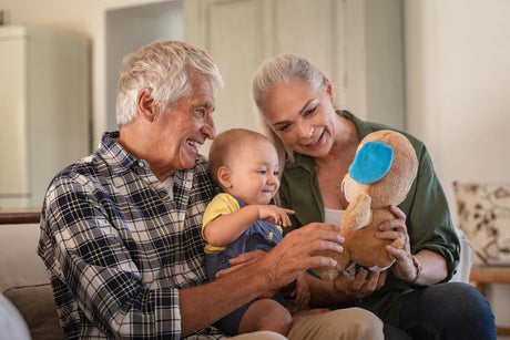 Grandparents playing with baby