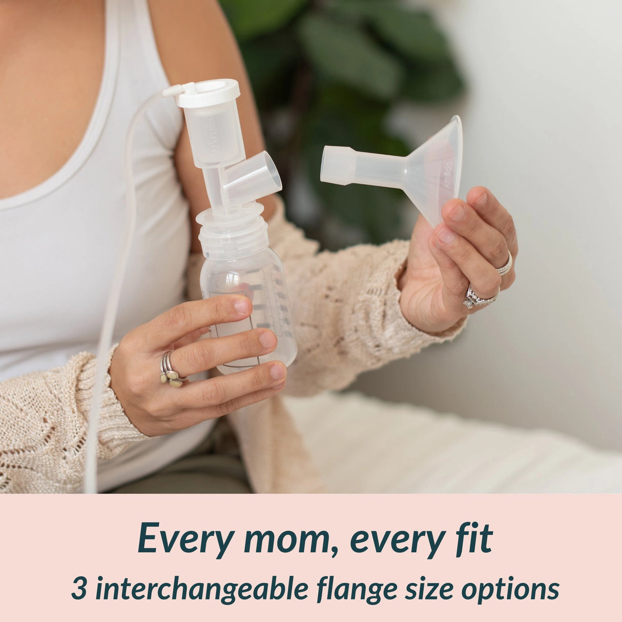 Mother holding an Ameda CustomFit 2-piece flange and breast pump kit, showing the 3 interchangeable flange size options — 17mm, 19mm, and 21mm