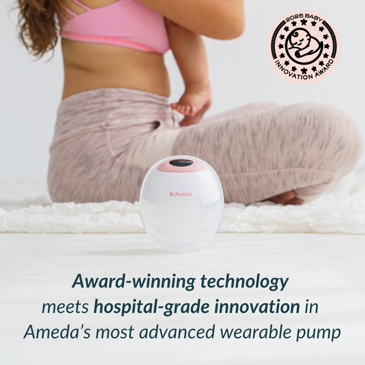 Mother sitting cross-legged with baby holding foot, Ameda GLO wearable breast pump in front, 2025 Baby Innovation Award badge