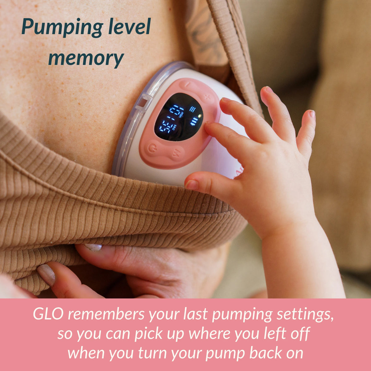 Close-up of Ameda GLO pump display on a mother's chest with toddler's hand reaching toward it, illustrating pumping level memory feature