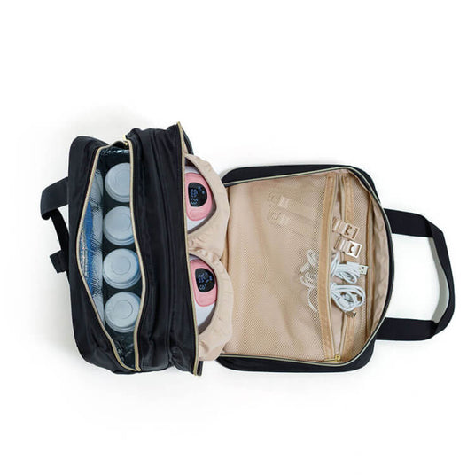 Open black bag with a section holding a breast pump and accessories on one side, and bottles stored in an insulated compartment on the other side.