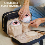 Person organizing breast pumps and supplies in a travel bag with text 'Freedom to pump anywhere'.