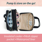 Open insulated cooler bag with mesh zipper pocket and waterproof liner on a light pink background.