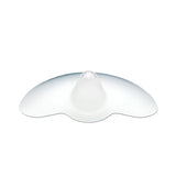 A translucent silicone nipple shield with a rounded central projection and wide, curved edges designed to aid breastfeeding. The shield has a smooth surface and is primarily clear, allowing for light to pass through.